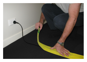 Apply the TripSafe carpet cable holder on your loose electrical cords